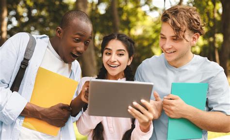 Students reviewing test prep material together on a tablet
